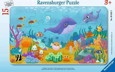 Children's puzzle with ocean-themed design featuring animals and plants, branded as Ravensburger.