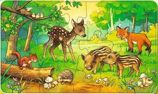Children's ravensburger puzzle with forest animals including a deer, fox, and pigs on a green background.