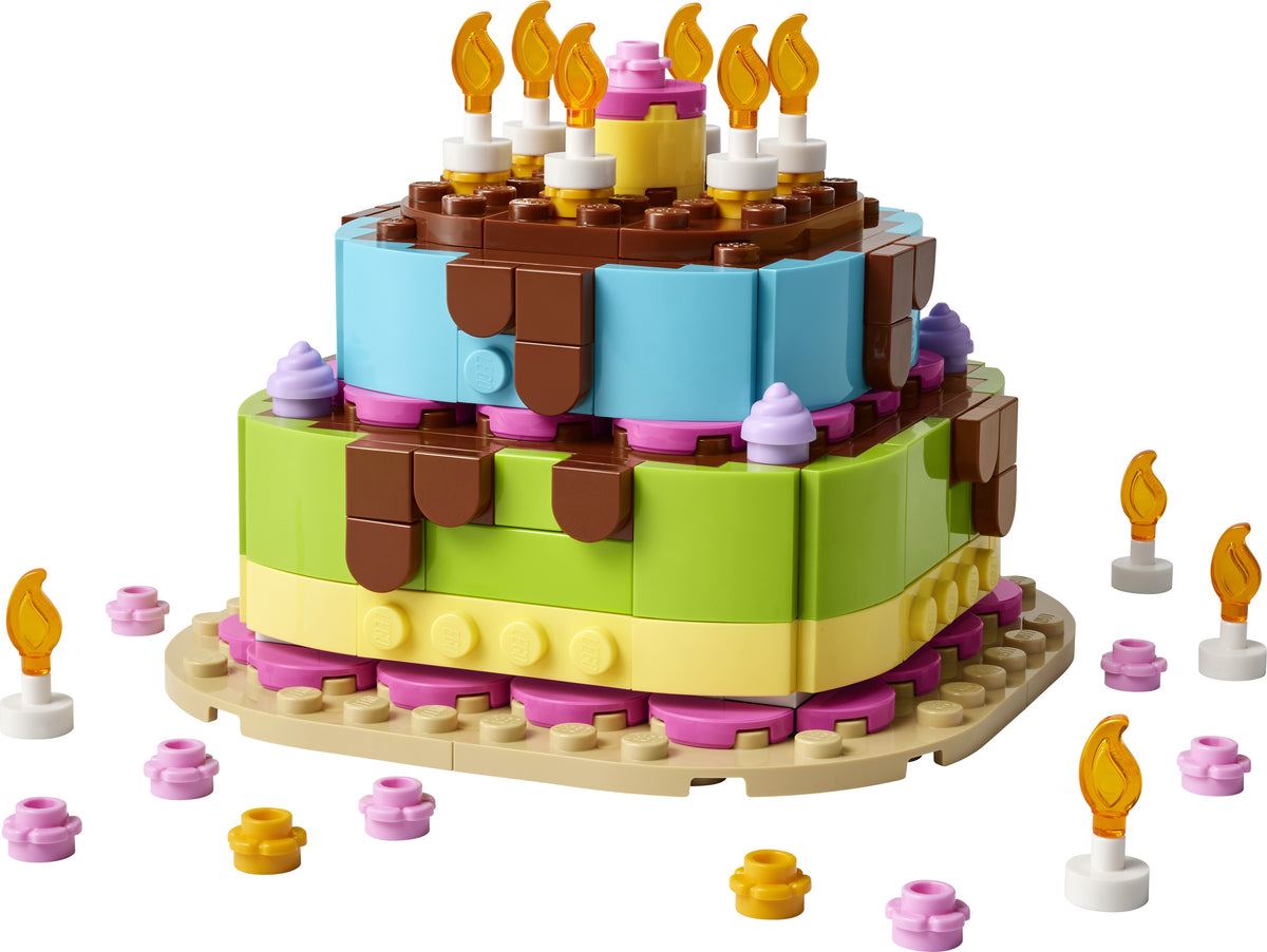 LEGO birthday cake set with candles on a white background