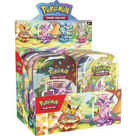Pokémon trading card game packaging with colorful designs and character illustrations.