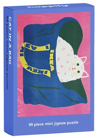 happily 99-piece mini jigsaw puzzle packaging with a cat in an ikea bag on a blue and pink background