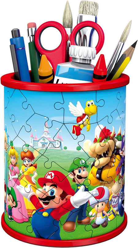 ravensburger  3d puzzle mario Pencil holder with cartoon characters and stationery items on a white background