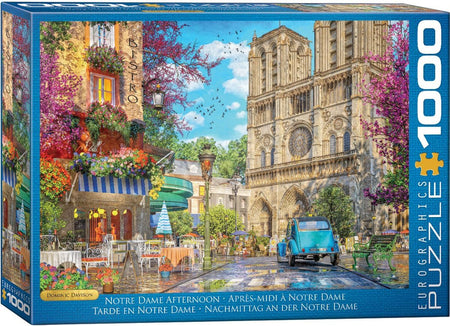 Eurographics 1000-piece Jigsaw puzzle box featuring Notre Dame Cathedral with a blue car and colorful afternoon street scene.