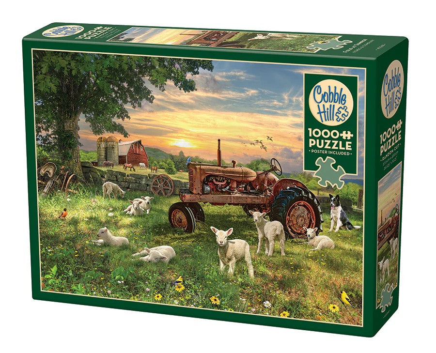 Cobble Hill 1000-piece jigsaw puzzle box with a tractor and animals in a field at sunrise
