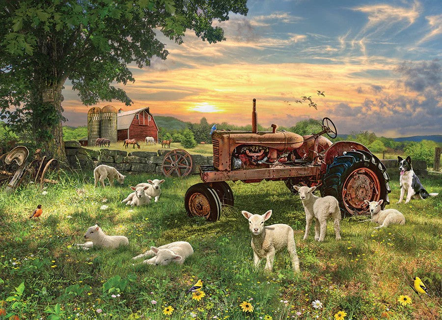 Cobble Hill 1000-piece jigsaw puzzle of a Vintage tractor in a pastoral scene with sheep and dogs at sunset.