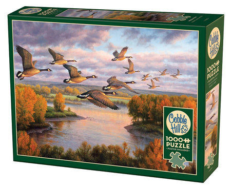 Cobble Hill 1000-piece jigsaw puzzle box with geese flying over a river and autumn trees
