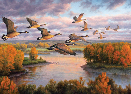 Cobble Hill 1000-piece jigsaw puzzle of Geese flying over a river with autumn trees on either side
