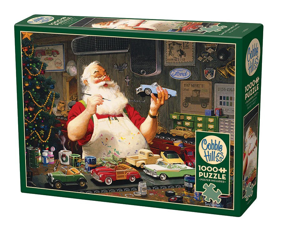 Cobble Hill Jigsaw puzzle box featuring a Santa Claus painting model cars in a workshop