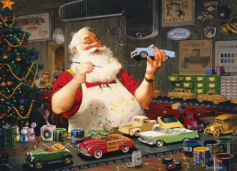 Cobble Hill puzzle of Santa Claus in a workshop with model cars and Christmas decorations