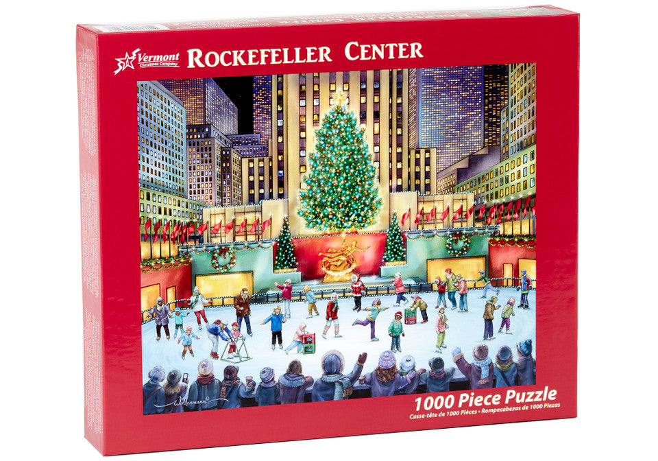 Vermont Christmas Company 1000-piece jigsaw puzzle box featuring Rockefeller Center with a Christmas tree and people around it.