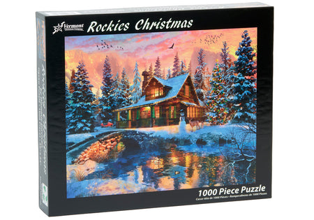 Vermont christmas company 1000-piece Jigsaw puzzle box featuring a winter scene with a cabin and trees, labeled 'Rockies Christmas'.