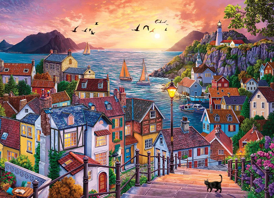 Cobble hill 1000-piece jigsaw puzzle of a colorful coastal village with houses, boats, and a sunset.