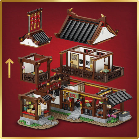 Legos set depicting a traditional building with detailed architecture on a red background