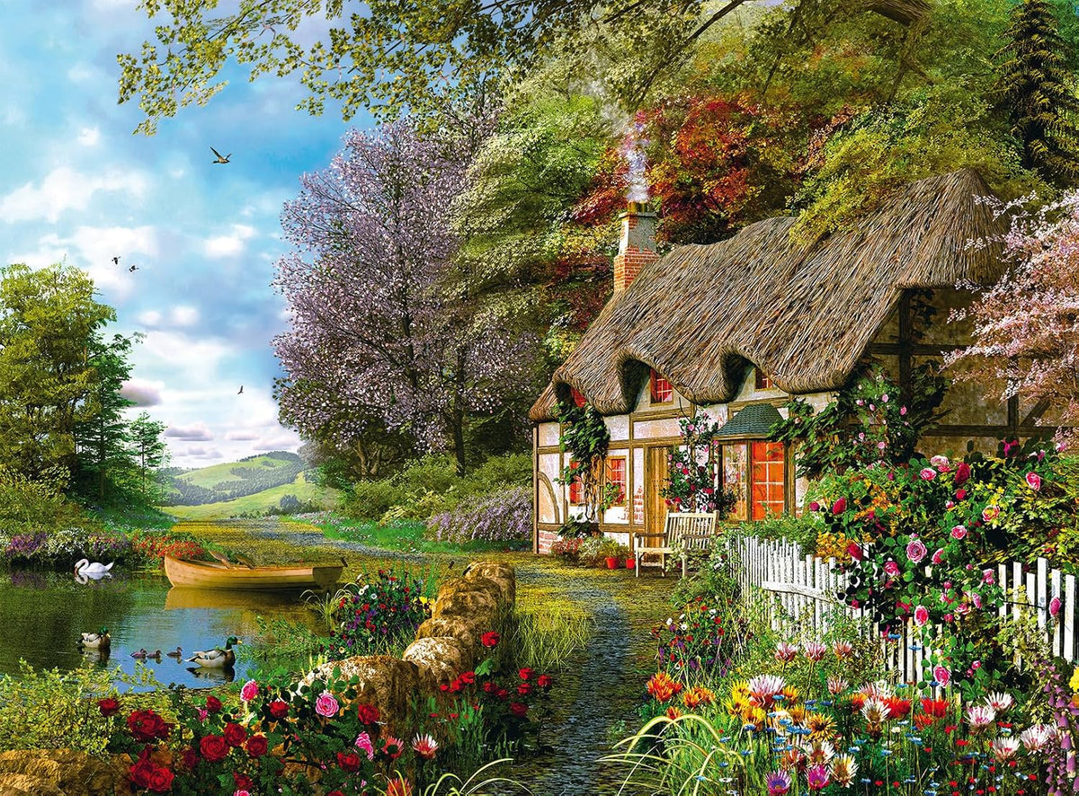 ravensburger country cottage jigsaw puzzle of Thatched cottage by a river with flowers and trees