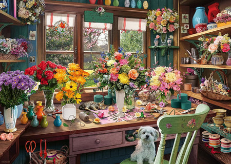 ravensburger flower arranger's shed jigsaw puzzle featuring Colorful flower arrangements in a workshop with a dog sitting on a chair and cats on the table