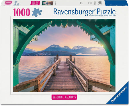 Ravensburger footbridge lac d'annecy jigsaw puzzle box with a scenic view of a dock and mountains.