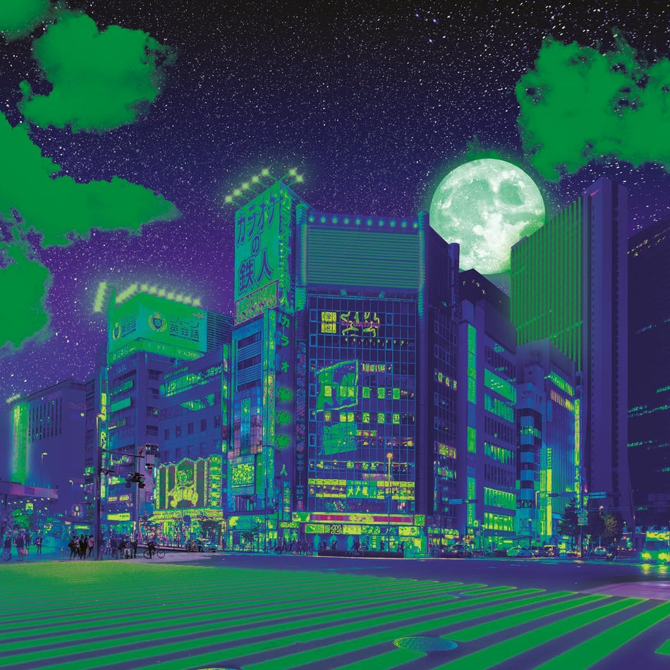 Colorful ravensburger neon tokyo puzzle cityscape of Tokyo at night with tall buildings and a large moon in the sky.