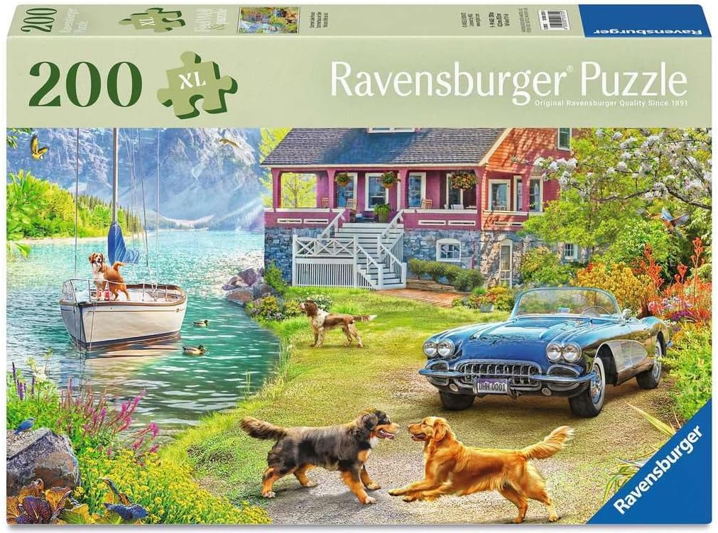 Ravensburger puzzle box with a scenic lakeside house and car, featuring dogs and a boat.