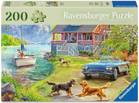 Ravensburger puzzle box with a scenic lakeside house and car, featuring dogs and a boat.