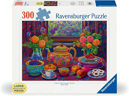 Ravensburger puzzle box with colorful tea set and flowers design